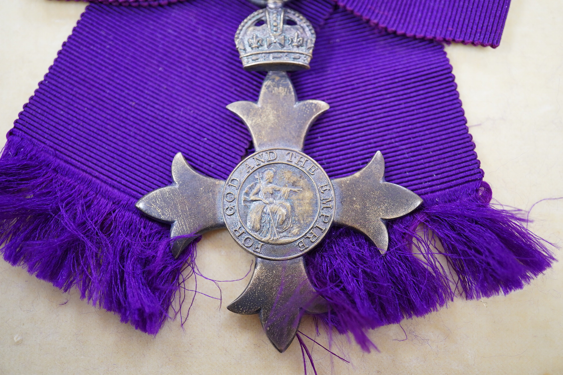 A George V silver gilt Civil O.B.E with purple ribbon and a 2nd type in gilt metal, both cased. Condition - fair to good